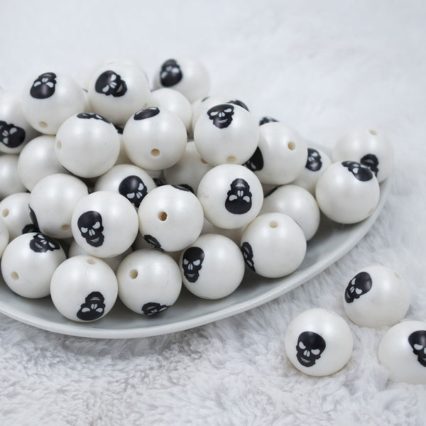 Front view of a pile of 20mm Black Skull Print Chunky Acrylic Bubblegum Beads [10 Count]