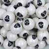 Close up view of a pile of 20mm Black Skull Print Chunky Acrylic Bubblegum Beads [10 Count]