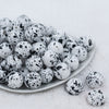 Front view of a pile of 20mm White with Black Splatter Chunky Acrylic Bubblegum Beads