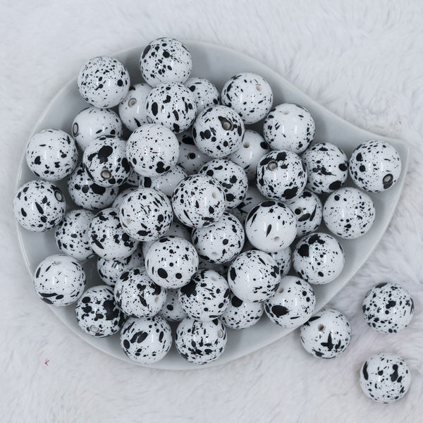 Top view of a pile of 20mm White with Black Splatter Chunky Acrylic Bubblegum Beads