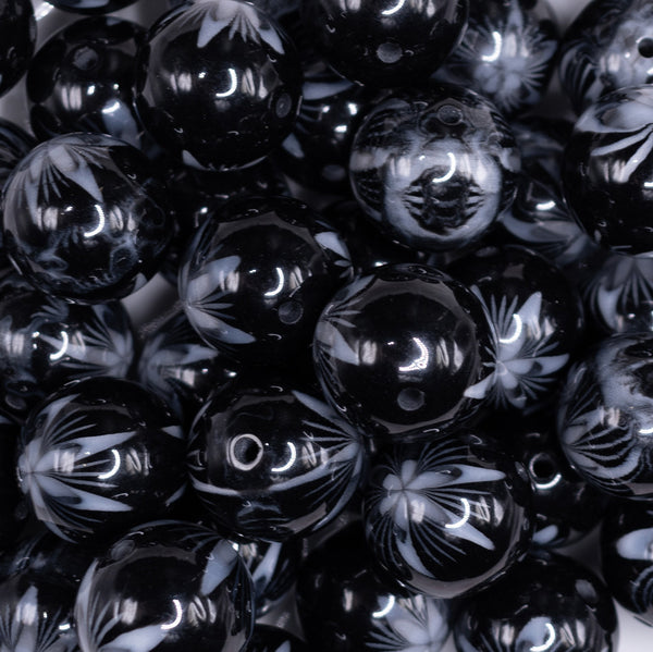 close up view of a pile of 20mm Black with White Marble Flower Bubblegum Beads