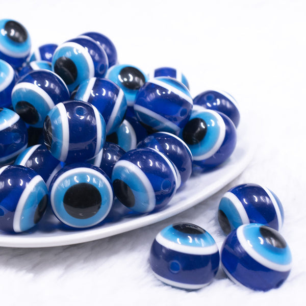 front view of a pile of 20mm Blue and Black Evil Eye Chunky Bubblegum Jewelry Beads
