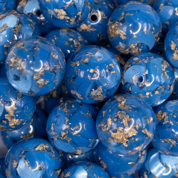 close up view of a pile of 20mm Blue and Gold Flake Resin Chunky Bubblegum Beads