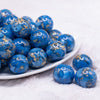front view of a pile of 20mm Blue and Gold Flake Resin Chunky Bubblegum Beads