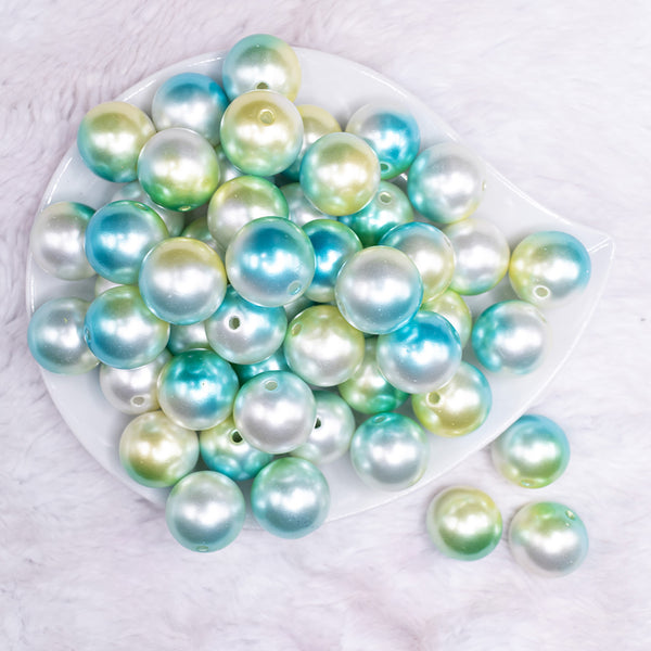 top view of a pile of 20mm Blue & Green Ombre Shimmer Faux Pearl Bubblegum Beads