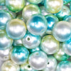close up view of a pile of 20mm Blue & Green Ombre Shimmer Faux Pearl Bubblegum Beads