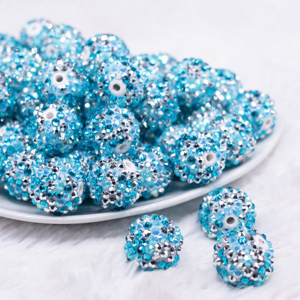 front view of a pile of 20mm Blue and Silver Confetti Rhinestone AB Bubblegum Beads
