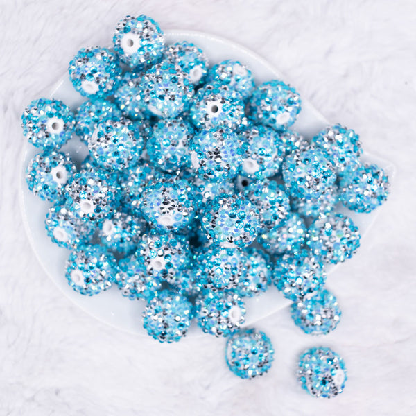 top view of a pile of 20mm Blue and Silver Confetti Rhinestone AB Bubblegum Beads