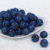 Front view of a pile of 20mm Blue & Black Confetti Rhinestone AB Bubblegum Beads