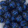 Close up view of a pile of 20mm Blue & Black Confetti Rhinestone AB Bubblegum Beads