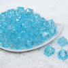 Front view of a pile of 20mm Blue Transparent Cube Faceted Pearl Bubblegum Beads