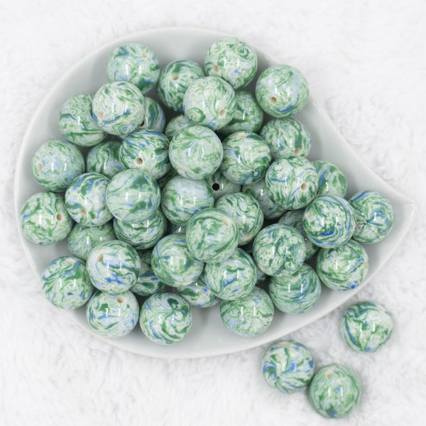 Top view of a pile of 20mm Green with Blue Swirl Pattern Chunky Acrylic Bubblegum Beads