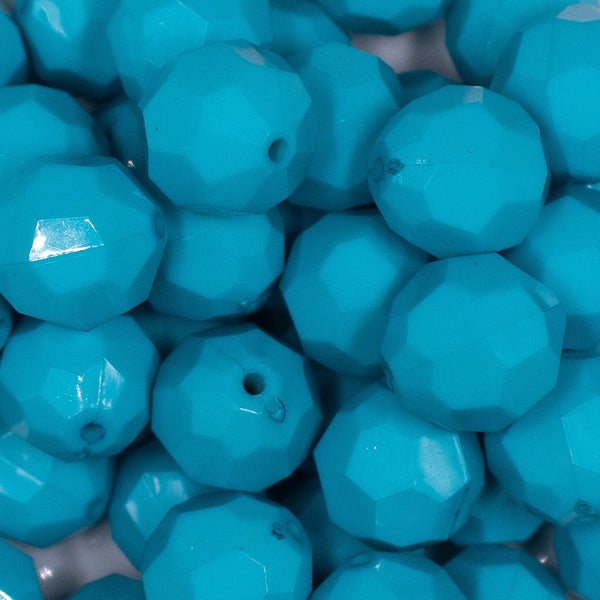 Close up view of a pile of 20mm Blue Faceted Opaque Bubblegum Beads