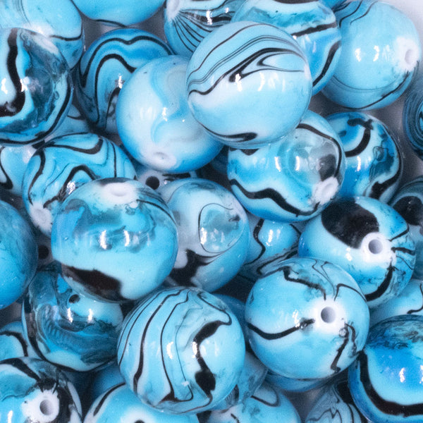 Close up view of a pile of 20mm blue Marbled Bubblegum Beads