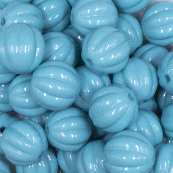Close up view of a pile of 20mm Blue Opaque Pumpkin Shaped Bubblegum Bead