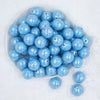 Top view of a pile of 20mm Silver Snowflake Print on Blue Acrylic Bubblegum Beads
