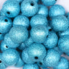Close up view of a pile of 20mm Blue Stardust Chunky Bubblegum Beads