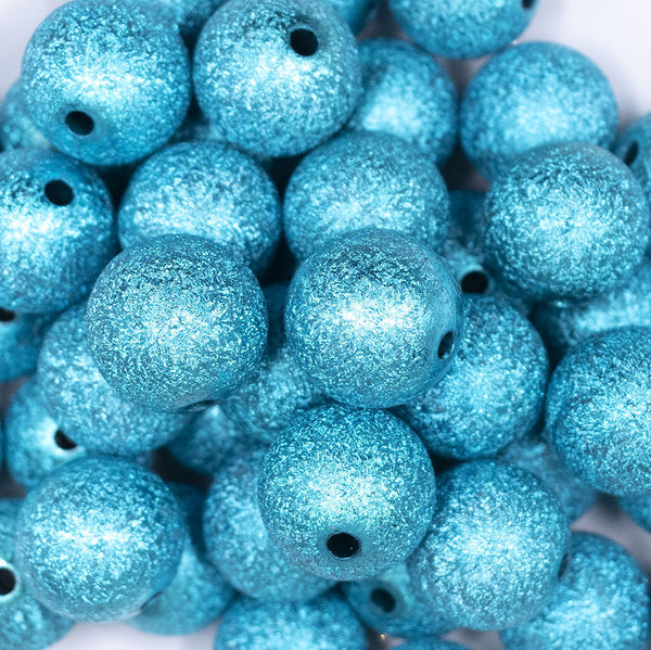 Close up view of a pile of 20mm Blue Stardust Chunky Bubblegum Beads