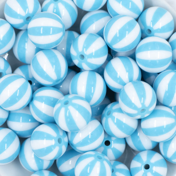 Close up view of a pile of 20mm Blue with White Stripe Beach Ball Bubblegum Beads