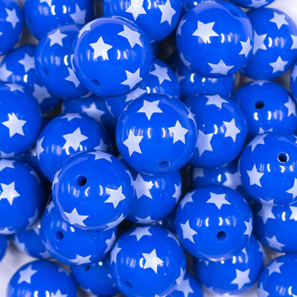Close up view of a pile of 20mm Blue with White Stars Acrylic Bubblegum Beads