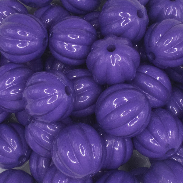 close up view of a pile of 20mm Deep Purple Opaque Pumpkin Shaped Bubblegum Bead