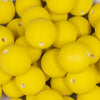 Close up view of a pile of 20mm Bright Yellow Matte 