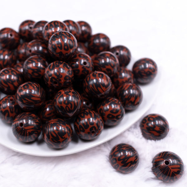 Front view of a pile of 20mm Brown and Black Leopard Animal Print Acrylic Bubblegum Beads