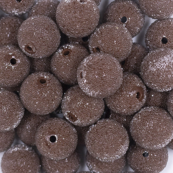 Close up view of a pile of 20mm Brown Sugar Glass Bubblegum Beads