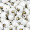Close up view of a pile of 20mm Bumble Bee Print Chunky Acrylic Bubblegum Beads [10 Count]