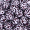 close up view of a pile of 20mm Burgundy & Black Splatter on White Acrylic Bubblegum Beads