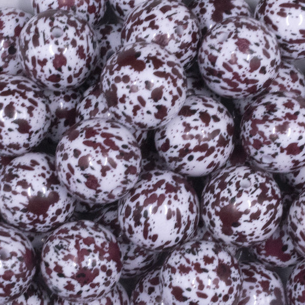 close up view of a pile of 20mm Burgundy & Black Splatter on White Acrylic Bubblegum Beads