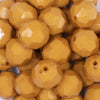 Close up view of a pile of 20mm Caramel Faceted Opaque Bubblegum Beads