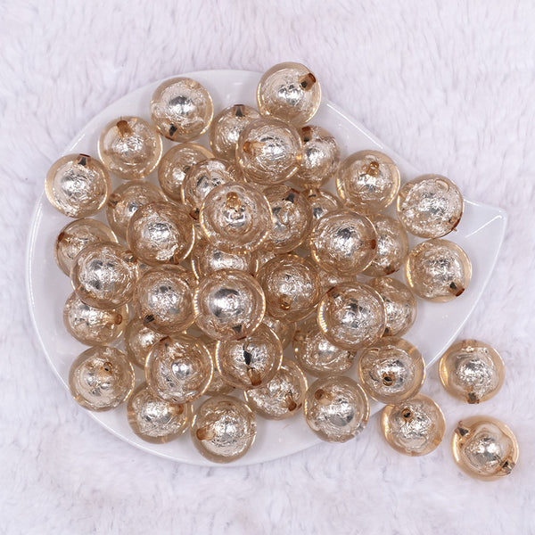 Top view of a pile of 20mm Champagne Gold Foil Bubblegum Beads