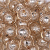 Close up view of a pile of 20mm Champagne Gold Foil Bubblegum Beads
