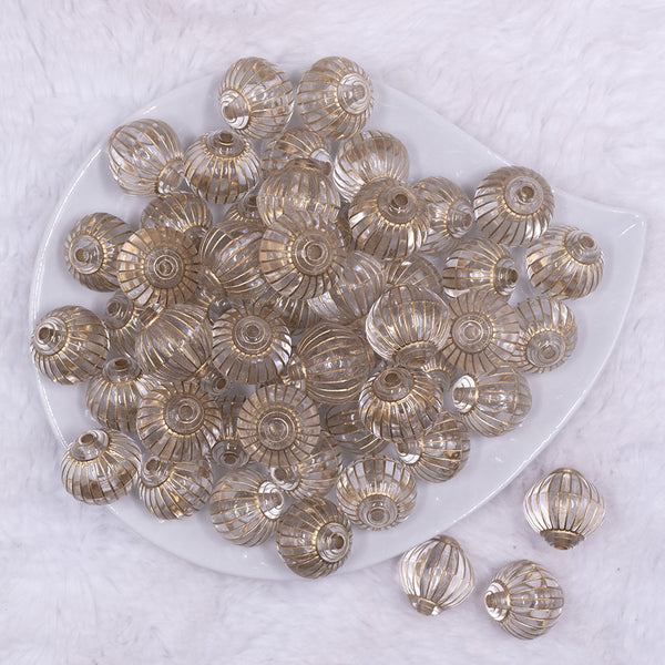 Top view of a pile of 20mm Clear with Antique Gold Trim Style Bubblegum Beads