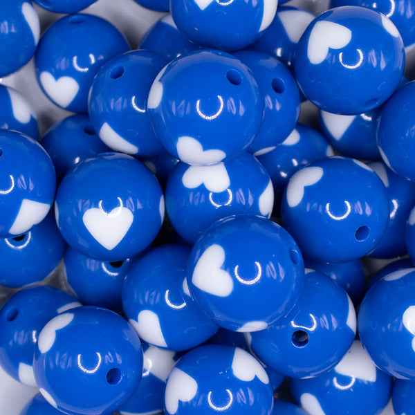 close up view of a pile of 20mm Cobalt Blue with White Hearts Bubblegum Beads