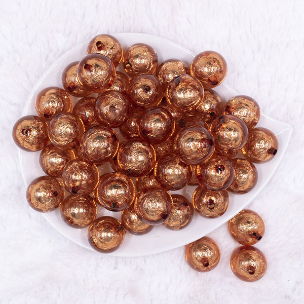 Top view of a pile of 20mm Copper Orange Foil Bubblegum Beads