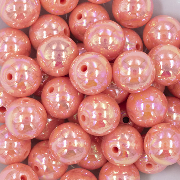 Close up view of a pile of 20MM Coral Orange AB Solid Chunky Bubblegum Beads