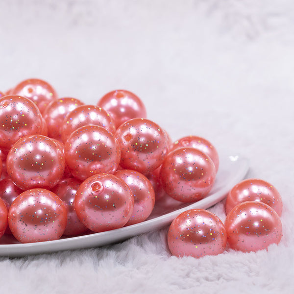 front view of a pile of 20mm Coral Pink with Glitter Faux Pearl Bubblegum Beads