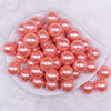 top view of a pile of 20mm Coral Pink with Glitter Faux Pearl Bubblegum Beads