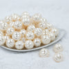 Front view of a pile of 20mm Cream Pearl Pumpkin Shaped Bubblegum Bead