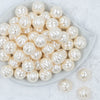 Top view of a pile of 20mm Cream Pearl Pumpkin Shaped Bubblegum Bead