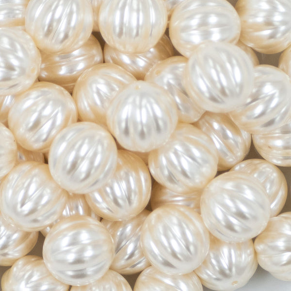 Close up view of a pile of 20mm Cream Pearl Pumpkin Shaped Bubblegum Bead