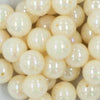 Close up view of a pile of 20MM Cream AB Solid Chunky Bubblegum Beads