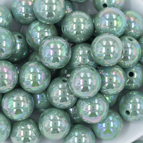 Close up view of a pile of 20MM Eucalyptus Green AB Solid Chunky Bubblegum Beads