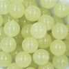 Close up view of a pile of 20mm Glow in the Dark Solid Bubblegum Beads