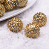 Macro view of a pile of 20mm Gold Flower Rhinestone Bubblegum Beads