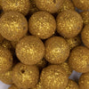 close up view of a pile of 20mm Gold Sparkling Glitter Acrylic Bubblegum Beads