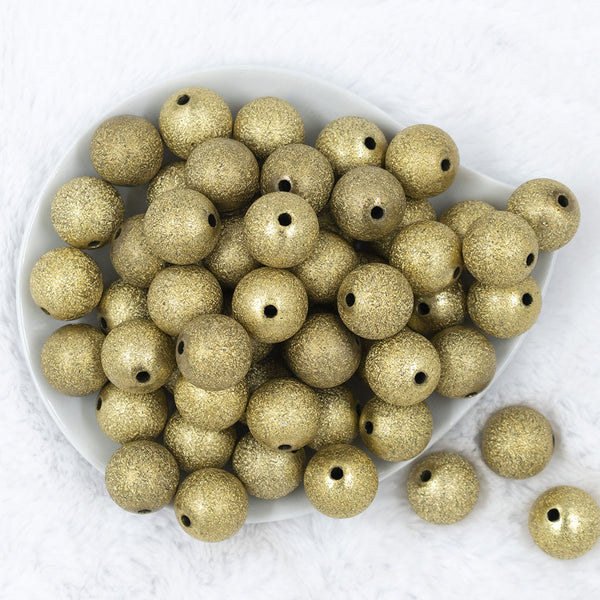 Top view of a pile of 20mm Gold Stardust Chunky Bubblegum Beads