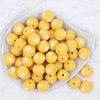 Top view of a pile of 20mm Golden Yellow with White Stars Bubblegum Beads